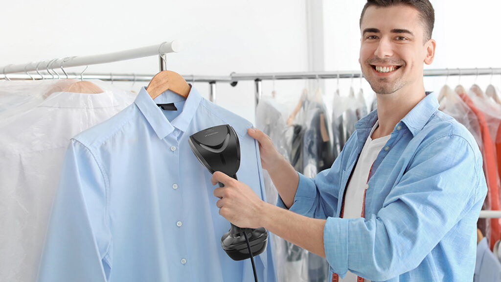 A man steam pressing shirt