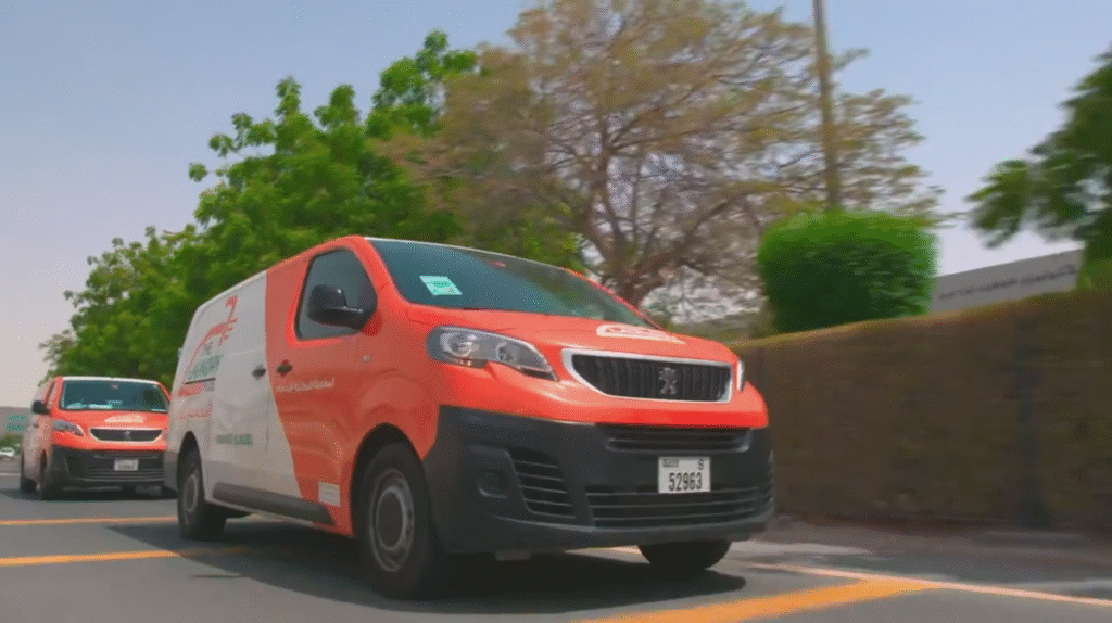 The Laundry Hub delivery van driving on city road