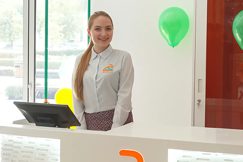 Friendly staff member at The Laundry Hub counter