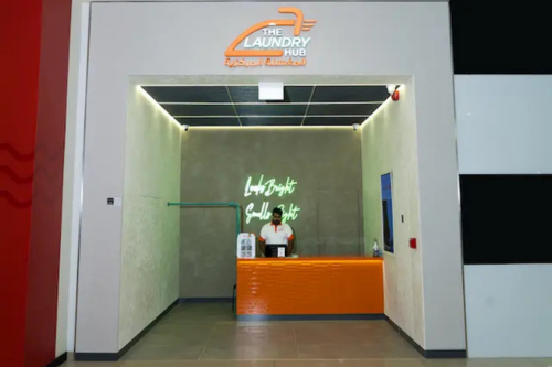 The Laundry Hub reception desk with modern branding